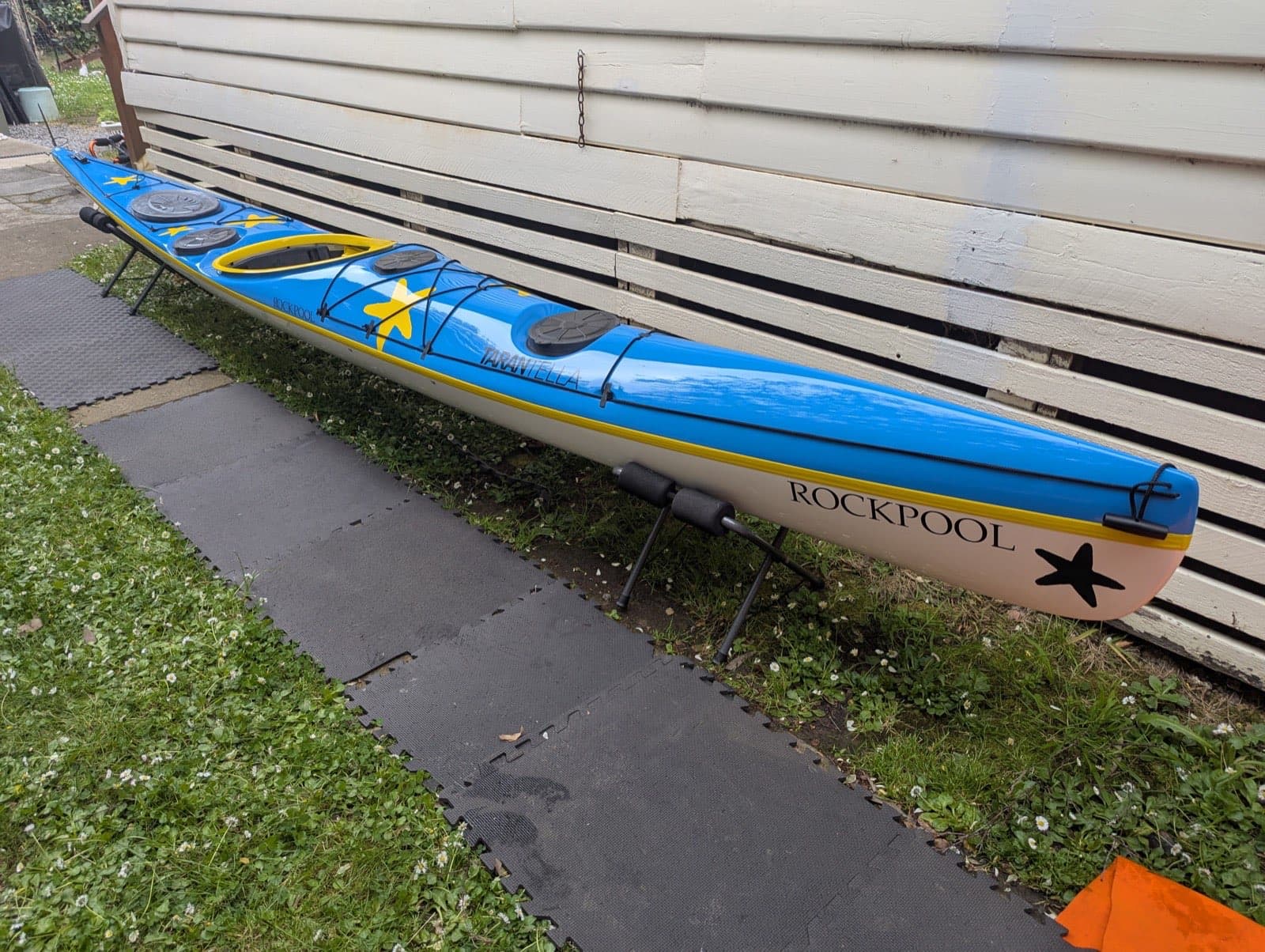 Rockpool Tarantella low-volume sea kayak deck view showing sleek hull design